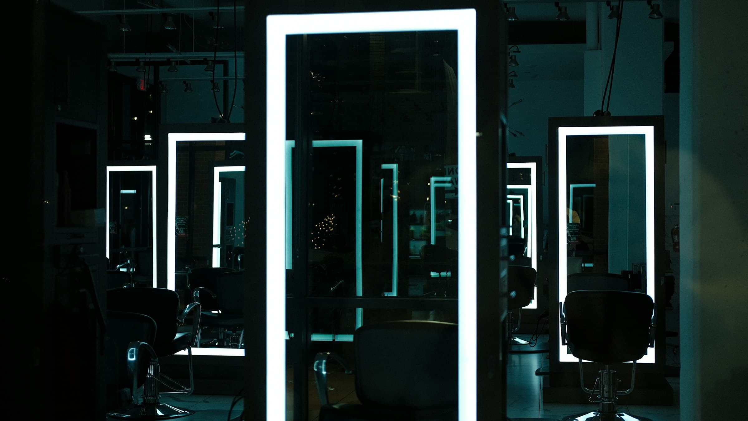 Modern hair salon interior with styling chairs and mirrors